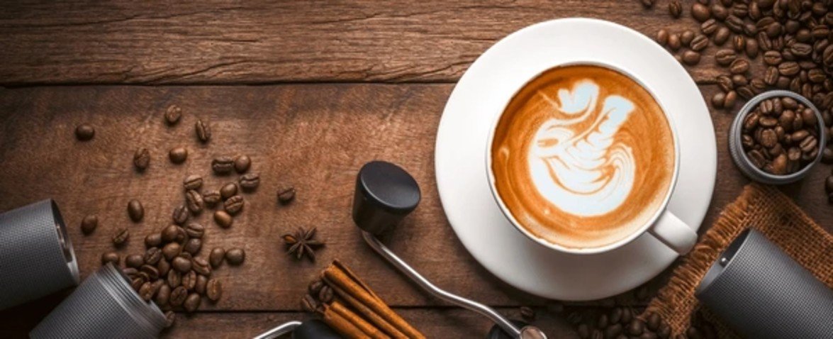Friendly staff at our cafe ready to assist you, featured on the Contact Us banner